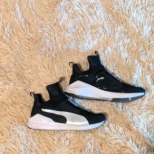 Black and white Puma shoes